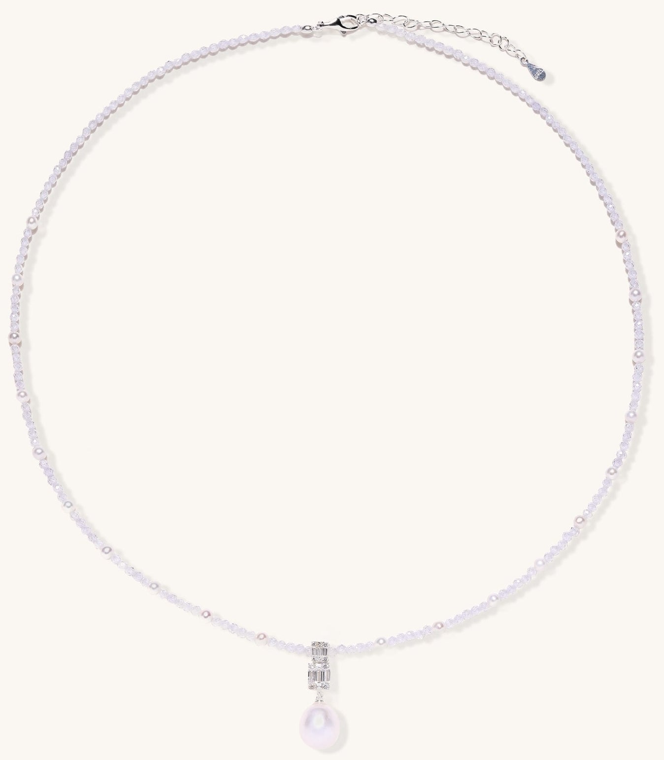 Delicate beaded necklace with lavender crystals, white pearls, and crystal pendant with pearl drop on white background.