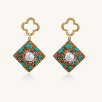 Gold quatrefoil stud earrings with ornate square pendants featuring turquoise stones and freshwater pearls