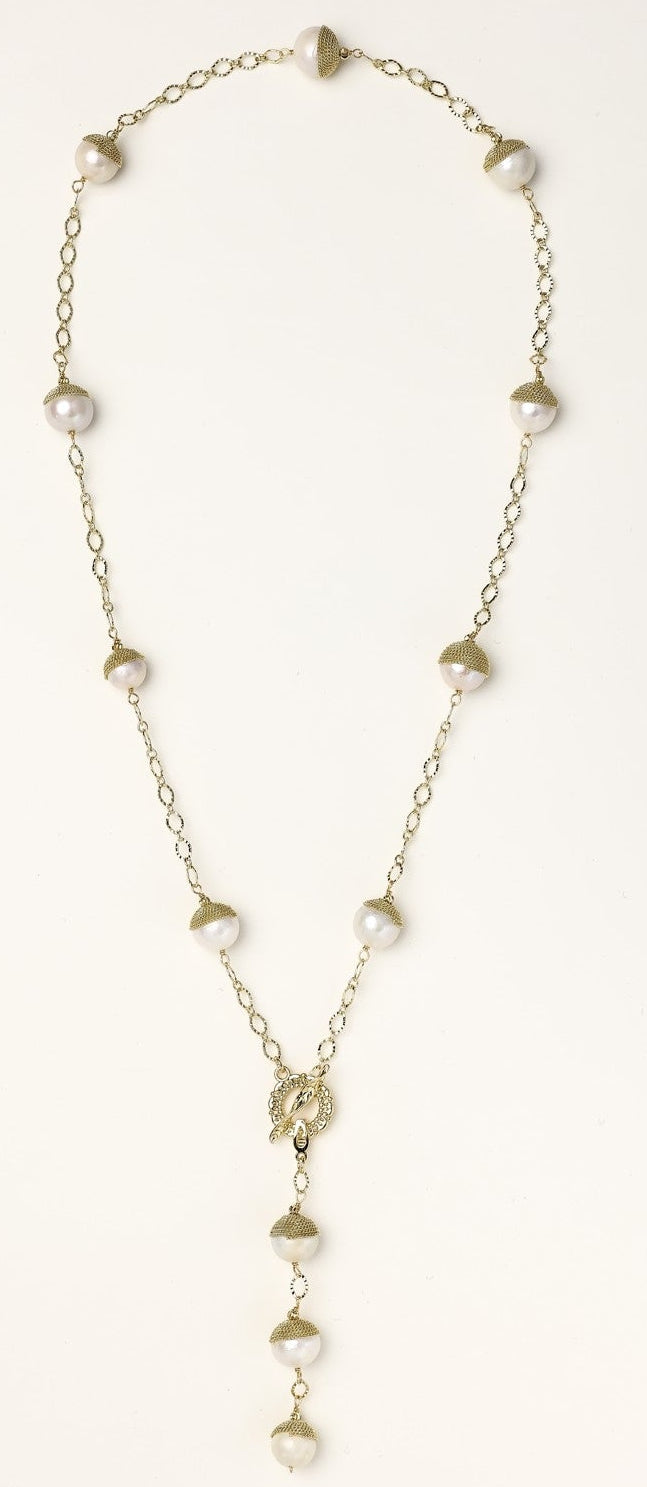 Long gold-plated lariat necklace featuring baroque pearls with metal caps arranged in elegant Y-shape design