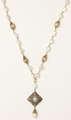 Elegant 14K gold plated necklace with freshwater pearls and ornate crystal diamond pendant on cream background.