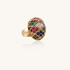 Domed gold-plated ring with geometric mosaic pattern featuring blue, green, red and clear zirconia stones in diamond settings