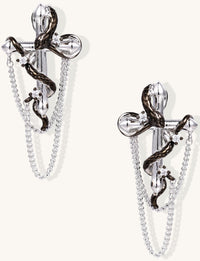 Gold-plated brass statement earrings featuring cross pendants with serpent details and hanging chains