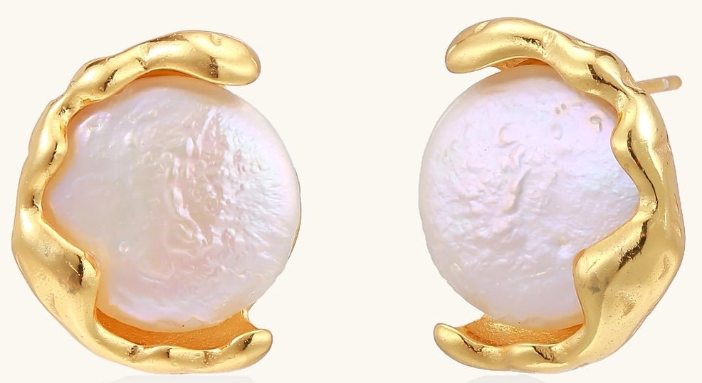 Gold-plated sterling silver stud earrings with organic claw settings cradling lustrous freshwater pearls on white background.