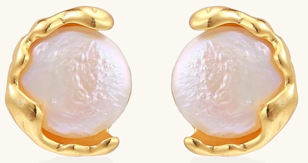 Gold-plated sterling silver stud earrings with organic claw settings cradling lustrous freshwater pearls on white background.