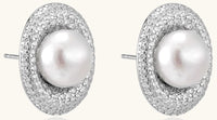 Sterling silver stud earrings with freshwater pearls surrounded by sparkling pavé crystals on white background.