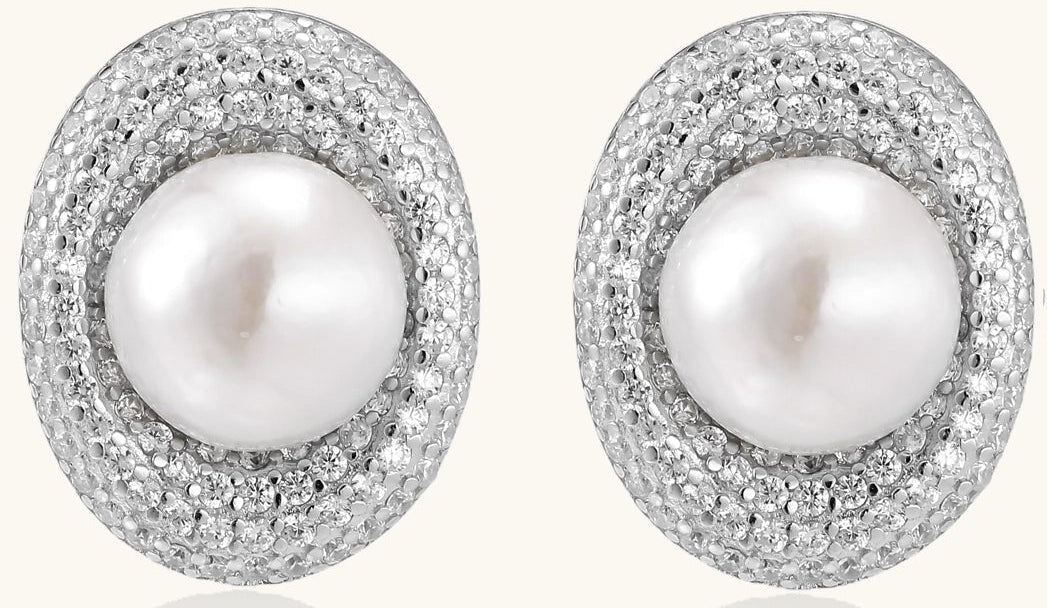 Sterling silver stud earrings with freshwater pearls surrounded by sparkling pavé crystals on white background.