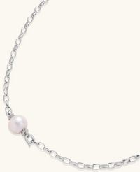 Sterling silver chain necklace with single white freshwater pearl centerpiece on neutral background, 445mm length.