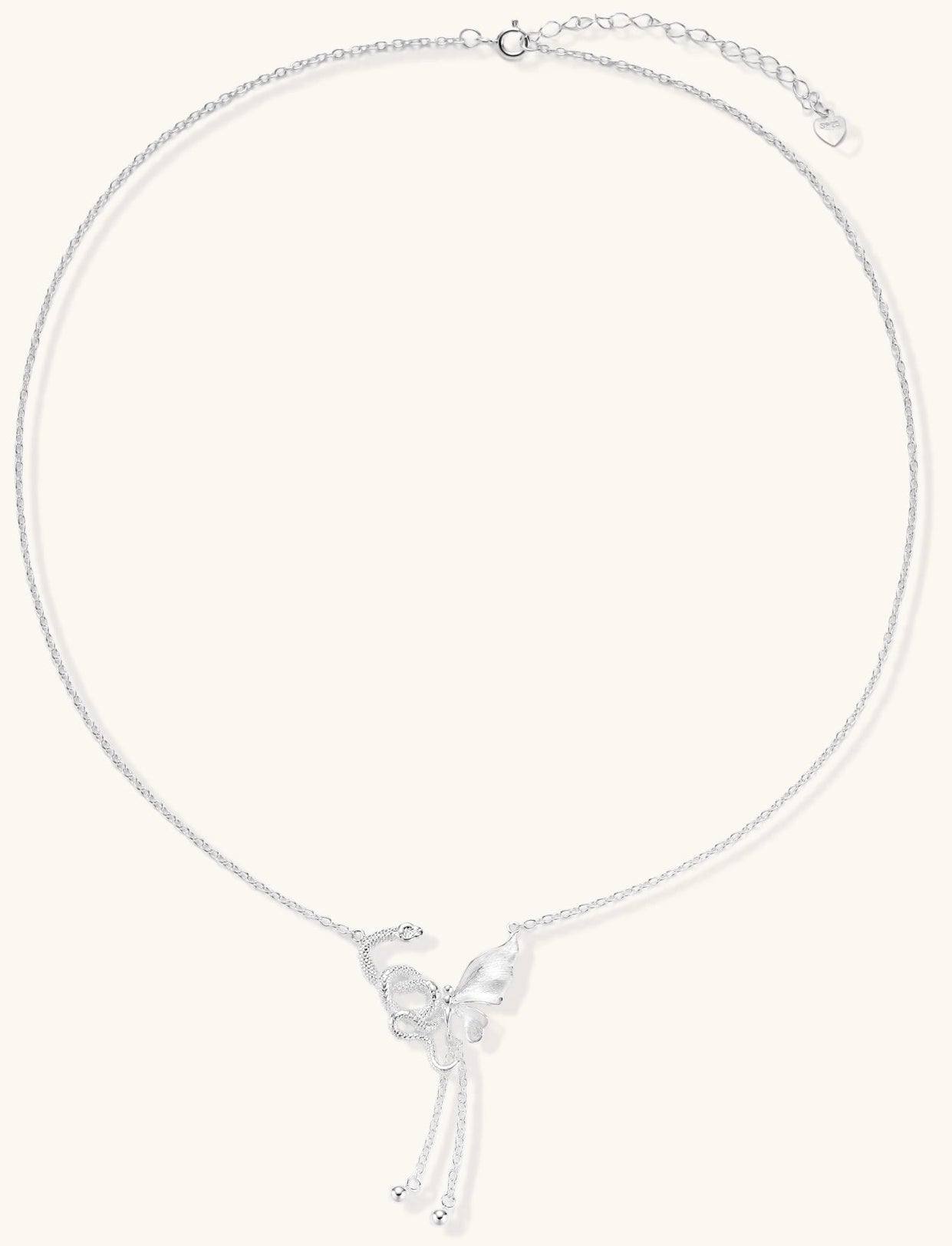 Delicate sterling silver butterfly pendant necklace with textured wing details and adjustable chain on white background