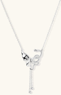Delicate sterling silver butterfly pendant necklace with textured wing details and adjustable chain on white background