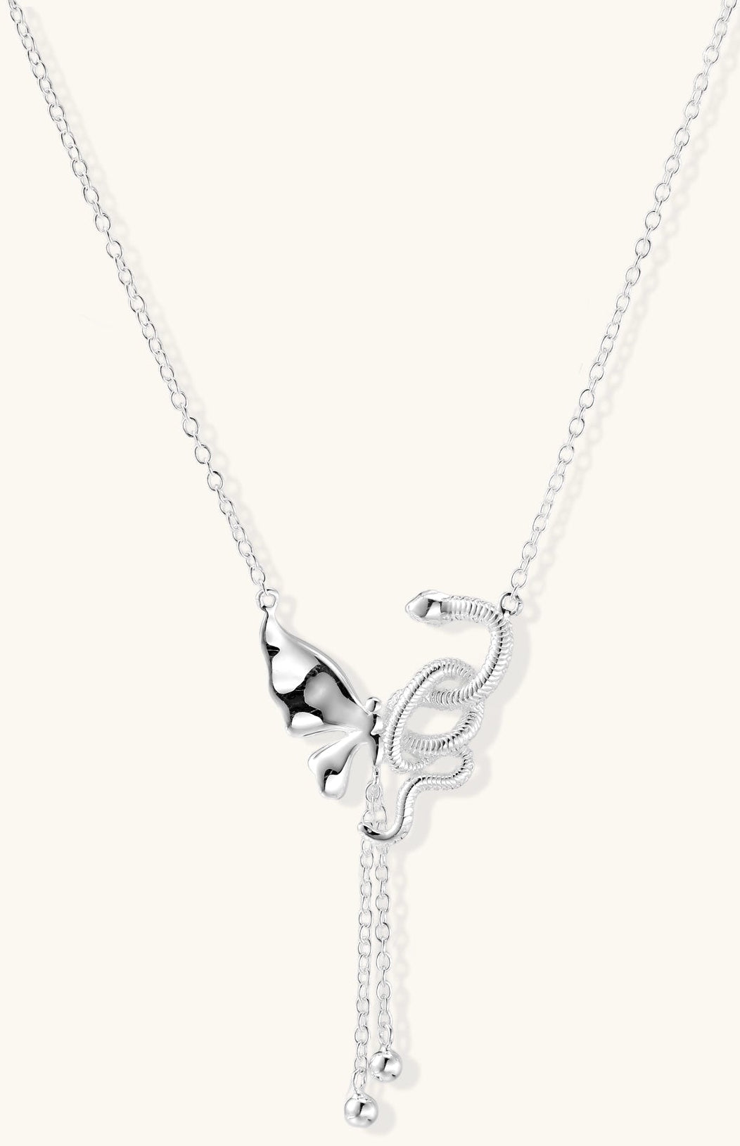 Delicate sterling silver butterfly pendant necklace with textured wing details and adjustable chain on white background