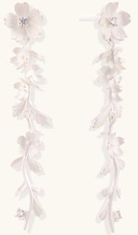 Pair of sterling silver dangle earrings with intricate leaf vine patterns and crystal accents on white background.