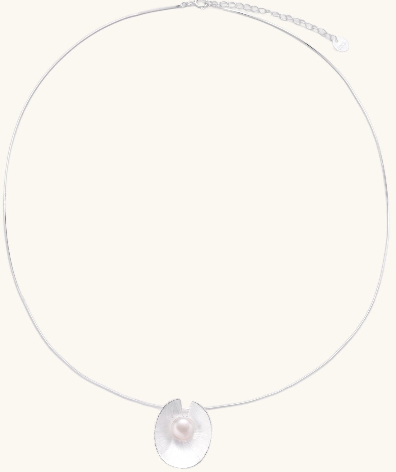 Delicate sterling silver necklace with oval iridescent pendant and central freshwater pearl on white background