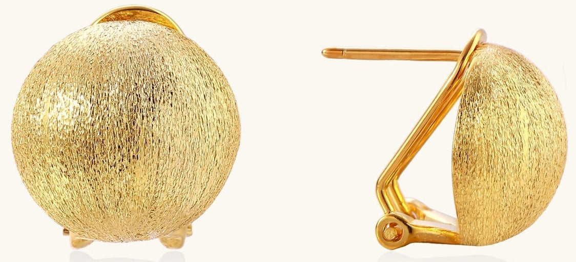 Close-up of textured gold-plated sterling silver dome clip-on earrings with brushed finish on white background.