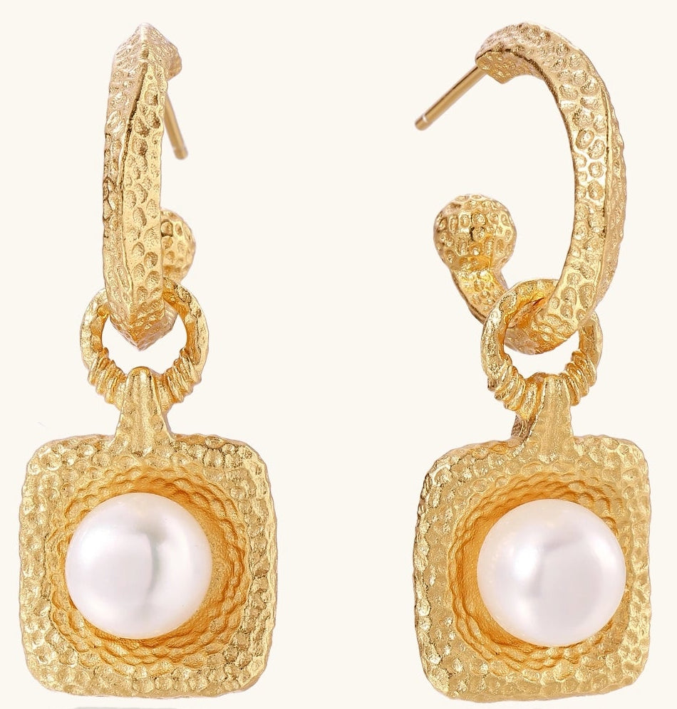 Gold-plated textured hoop earrings with square pendants containing freshwater pearls on white background