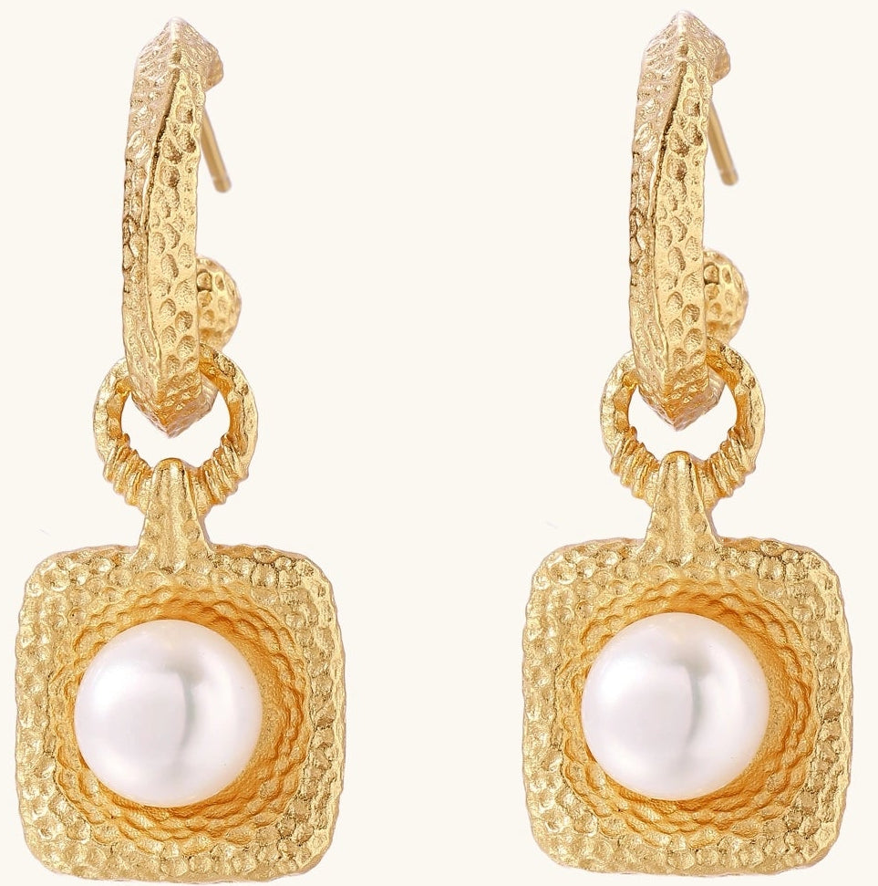Gold-plated textured hoop earrings with square pendants containing freshwater pearls on white background