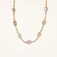 Iridescent baroque pearls alternating with small freshwater pearls on 14K gold-plated chain