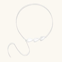Minimalist sterling silver necklace with three brushed leaf-shaped pendants on delicate chain against white background