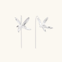 Delicate sterling silver dragonfly earrings with textured wings and curved threader hooks on white background