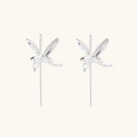 Delicate sterling silver dragonfly earrings with textured wings and curved threader hooks on white background