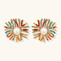 Vibrant starburst stud earrings with multicolor enamel rays and white pearl centers on gold-plated setting