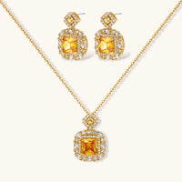 14K gold-plated jewelry set featuring square-cut cubic zirconia stones in ornate layered settings on white background.