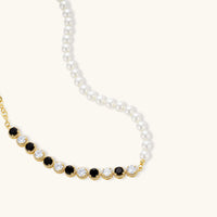 Gold-plated jewelry set with alternating black and clear cubic zirconia stones, featuring necklace, earrings and bracelet