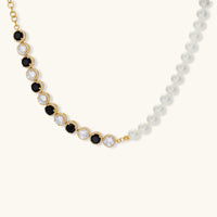 Gold-plated jewelry set with alternating black and clear cubic zirconia stones, featuring necklace, earrings and bracelet