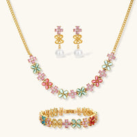 Gold-plated jewelry set with pink, turquoise and red flower-shaped cubic zirconia stones, featuring necklace, earrings and bracelet.