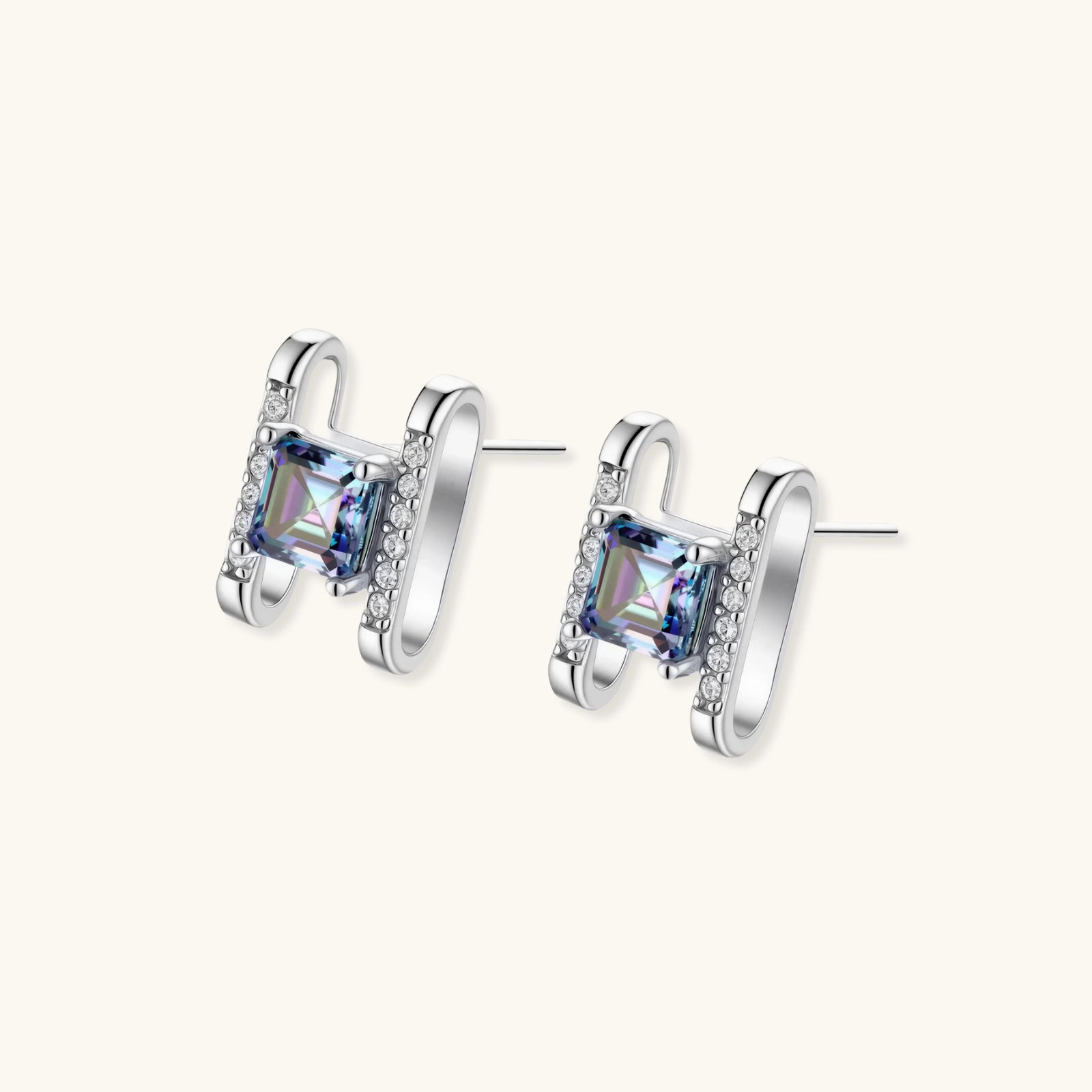 Square moissanite studs in sterling silver geometric setting showing rainbow prismatic fire on white background.