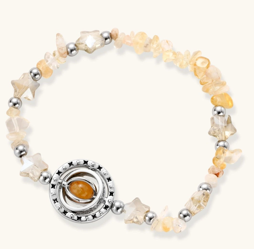 Complete jewelry set featuring citrine stone chips, silver beads, and cosmic circle pendants on cream background.