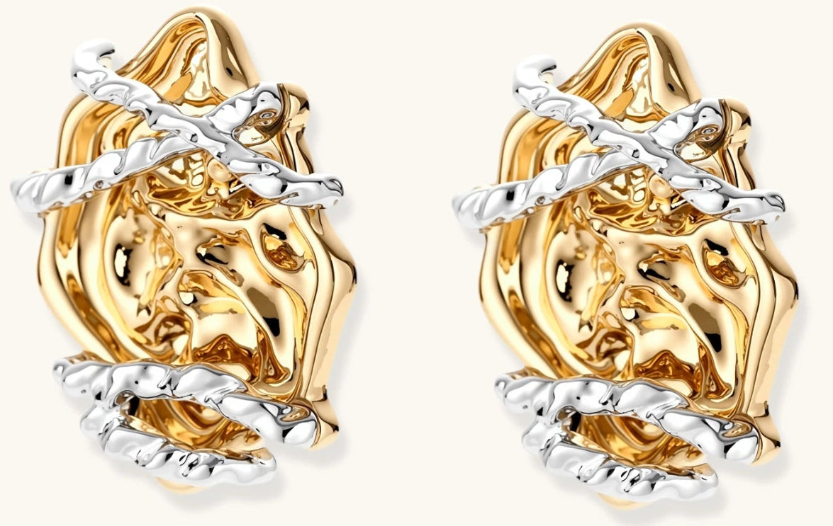 Sculptural rose-shaped stud earrings in gold with silver wire details and S925 posts on cream background.