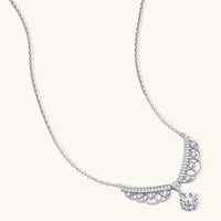 Delicate sterling silver necklace with intricate angel wing pendant featuring brilliant moissanite stones in openwork design