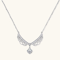 Delicate sterling silver necklace with intricate angel wing pendant featuring brilliant moissanite stones in openwork design