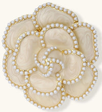 Elegant cream-colored rose brooch with gold plating, zirconia stones, and pearl-like border details on neutral background.