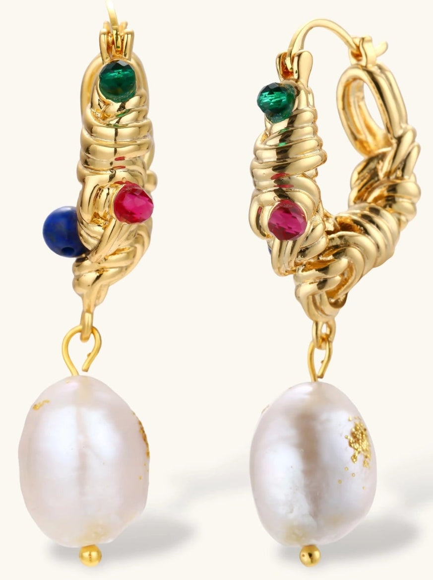 Ornate gold-plated hoop earrings with emerald, ruby, and sapphire accents, featuring dangling baroque freshwater pearls