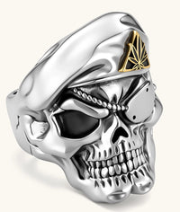 925 sterling silver skull ring wearing a military beret with a gold triangular cannabis leaf badge, blackened eye sockets, 23.9g.