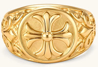 18K gold-plated stainless steel signet ring with ornate cross face and carved filigree scroll band, shown from three angles.