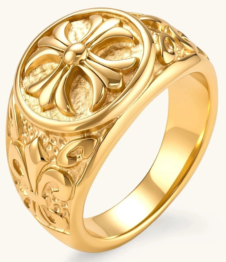 18K gold-plated stainless steel signet ring with ornate cross face and carved filigree scroll band, shown from three angles.