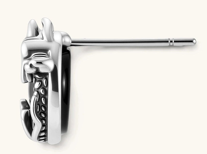 Silver stainless steel stud earring with coiled dragon motif wrapped around a black stone, shown from front and side.