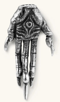Silver stainless steel stud earring shaped like a skeletal demon claw hand with an eye motif on the palm and sharp talon fingers.
