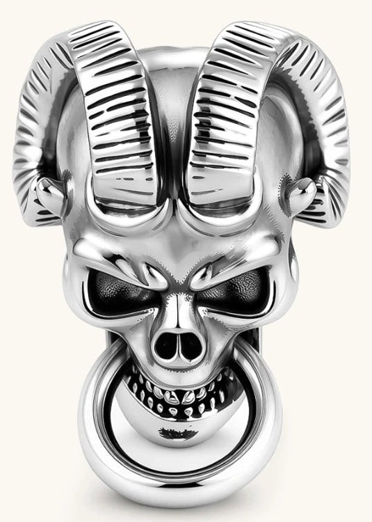 Silver 316L stainless steel stud earring shaped as a horned demon skull with ram horns and a dangling mouth ring.