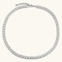 Silver 316L stainless steel carved curb chain necklace with lobster clasp and extender, 7.2mm wide, on cream background.