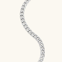 Silver 316L stainless steel carved curb chain necklace with lobster clasp and extender, 7.2mm wide, on cream background.