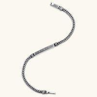 Silver stainless steel men's bracelet with braided foxtail chain, Greek key engraved bar, and decorative cube connectors.