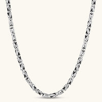 Men's antique silver Byzantine chain necklace, 6.2mm wide interlocking S-link pattern with ornate lobster clasp, 560mm length.