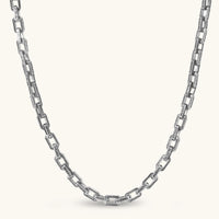 Silver 316L stainless steel rectangular link chain necklace with intricate scroll engravings, 560mm length, 7.1mm width.