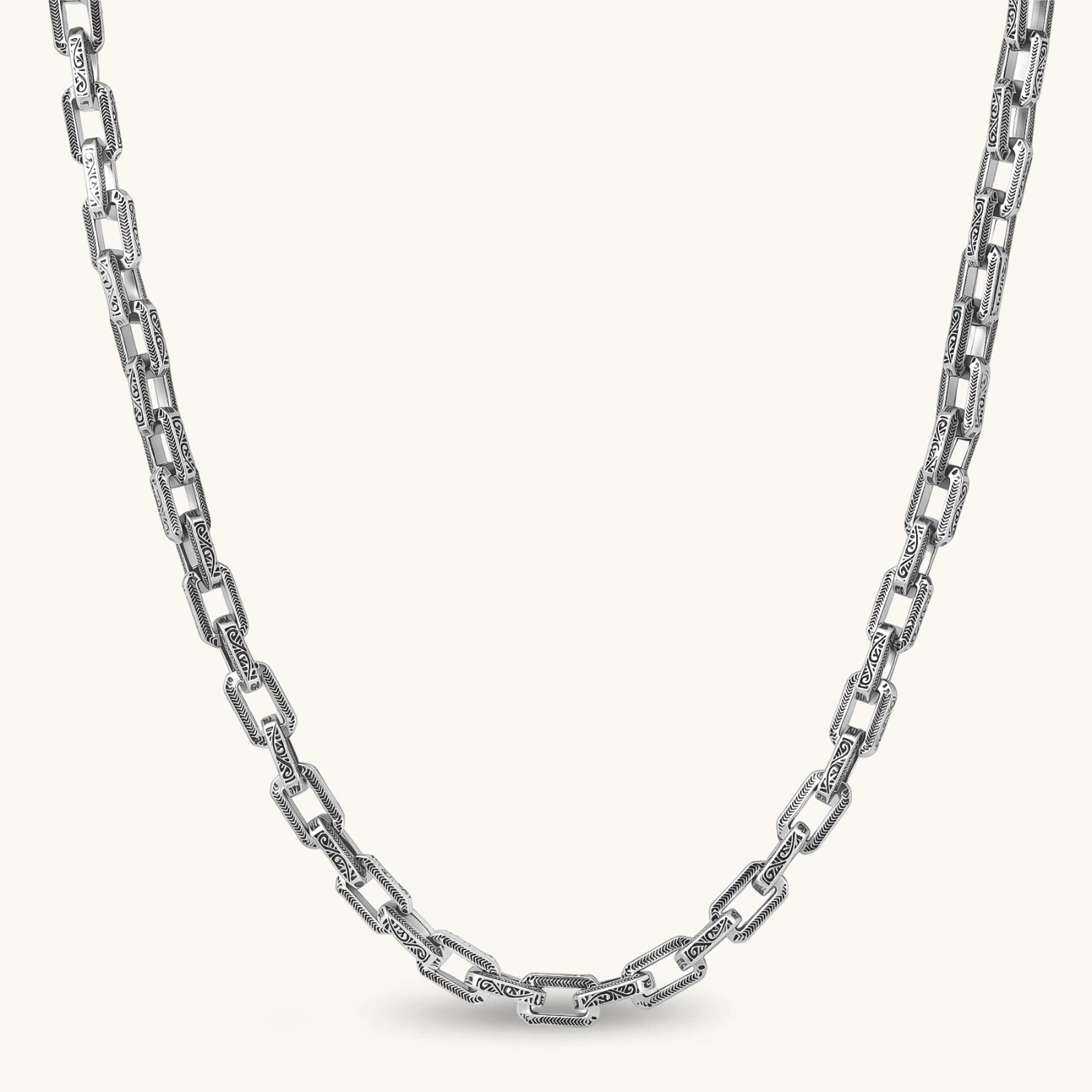 Silver 316L stainless steel rectangular link chain necklace with intricate scroll engravings, 560mm length, 7.1mm width.