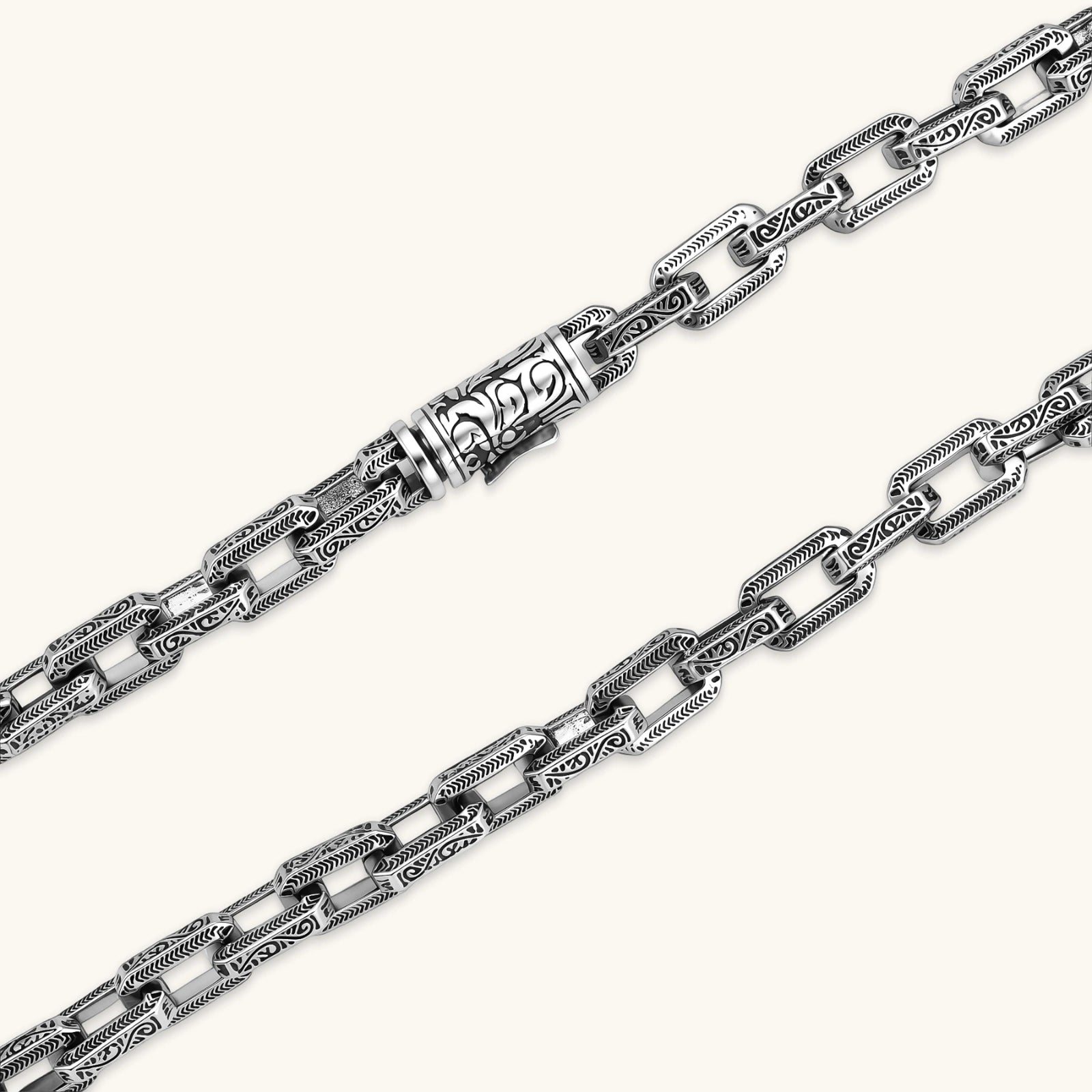 Silver 316L stainless steel rectangular link chain necklace with intricate scroll engravings, 560mm length, 7.1mm width.