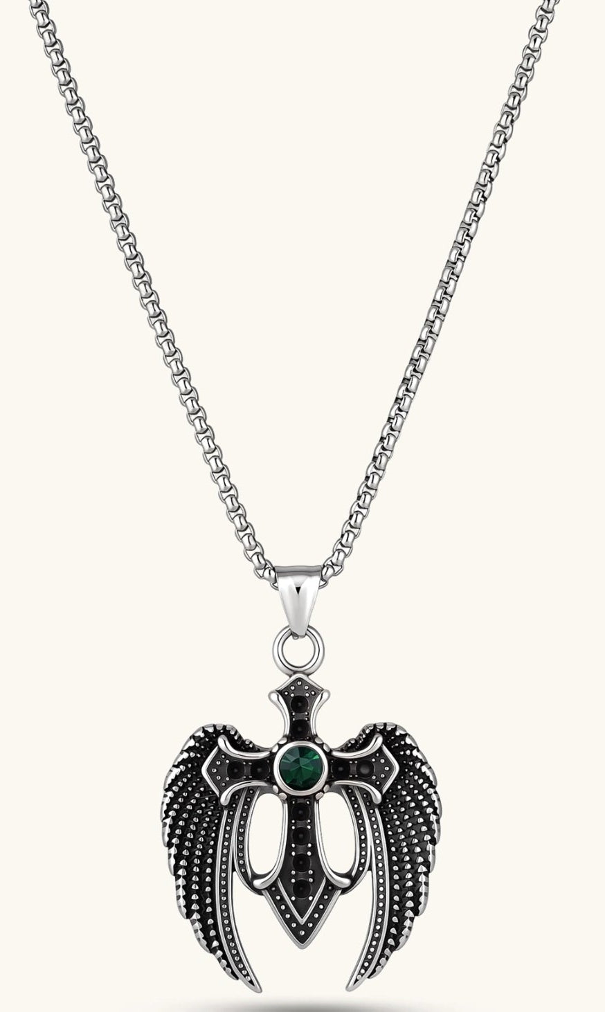 Silver stainless steel angel wing cross pendant necklace with green CZ center stone and black crystals on a box chain.