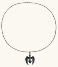 Silver stainless steel angel wing cross pendant necklace with green CZ center stone and black crystals on a box chain.